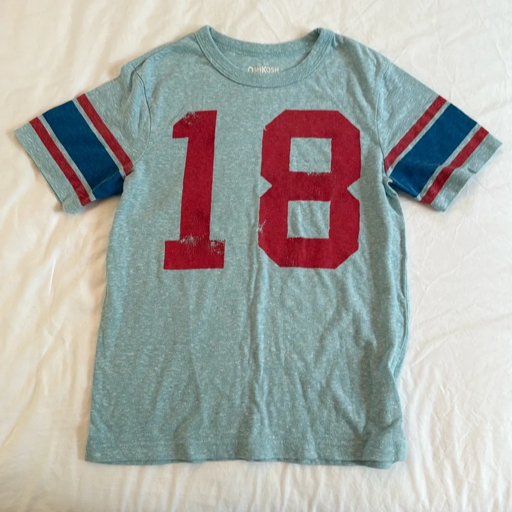 Size 8, Oshkosh T-shirt. Number 18.